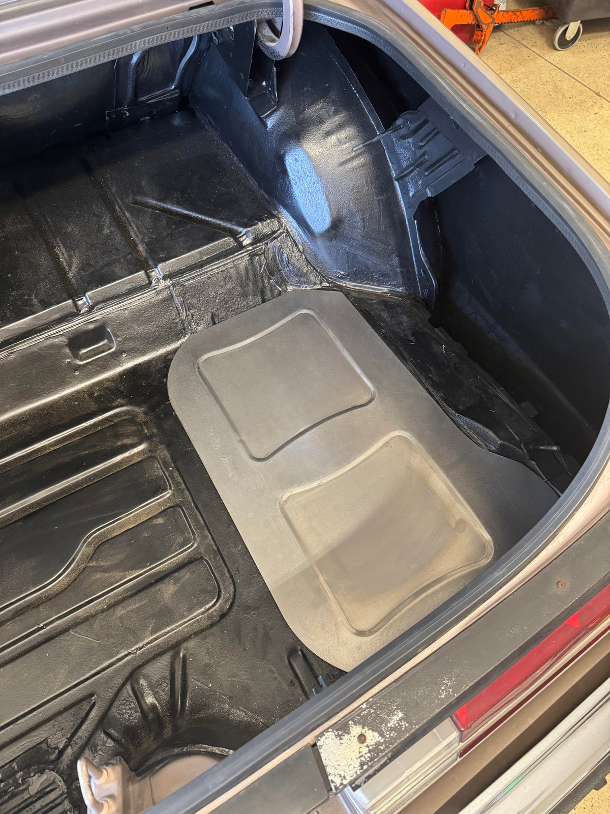 1978-1988 GM G-Body spare tire well delete panel. Formed steel trunk panel for Monte Carlo, Regal, Cutlass, Grand Prix and other G-Body builds. Made in USA.